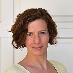 Nicola Twilley headshot, woman with short brown hair and yellow shirt.